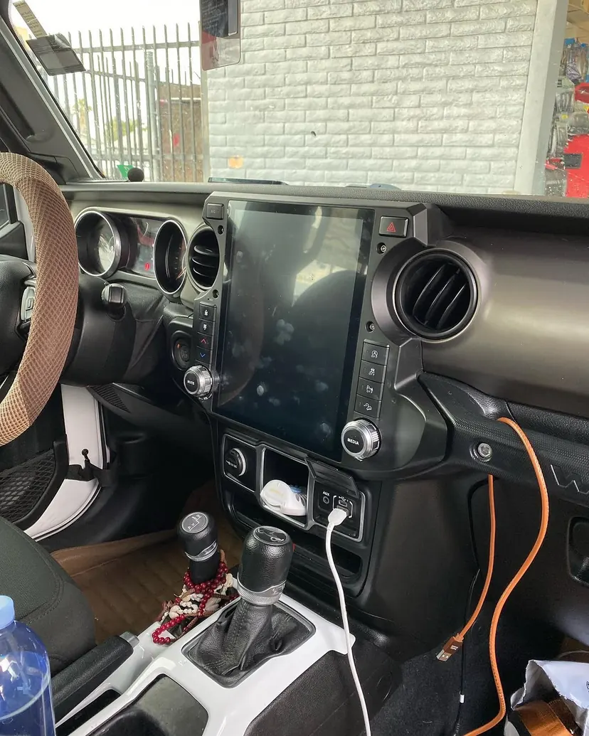 Large vertical touchscreen radio installed in a Jeep Wrangler dash by Sound Image